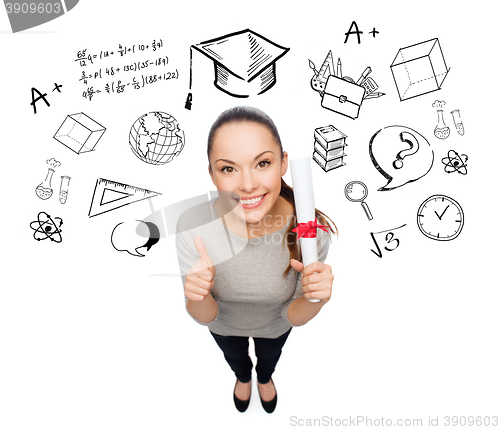 Image of woman with diploma showing thumbs up over doodles