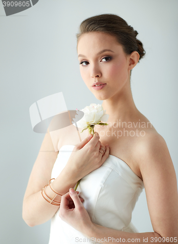 Image of beautiful asian woman with flower and jewelry