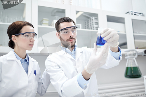 Image of young scientists making test or research in lab