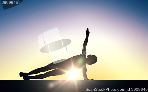 Image of woman doing plank exercise on stairs over sunlight