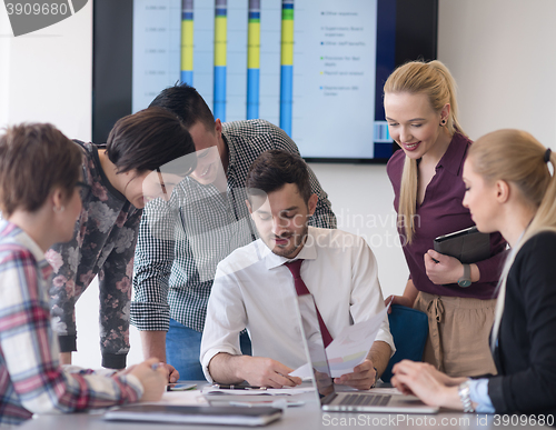 Image of young business people group on meeting at modern office