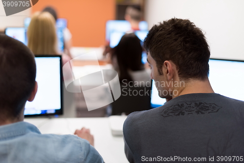 Image of technology students group working  in computer lab school  class