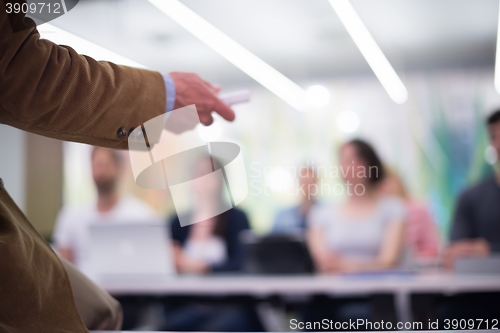 Image of close up of teacher hand while teaching in classroom