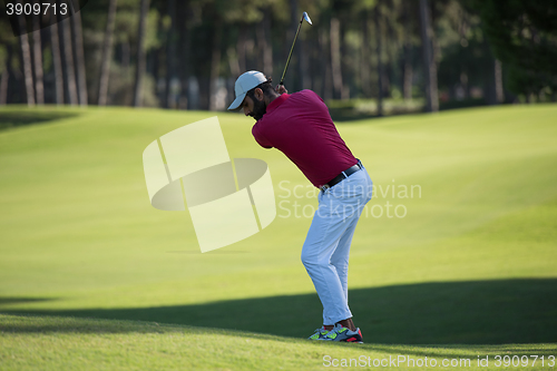 Image of golf player hitting long shot