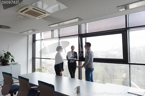 Image of young business people group on meeting at modern office