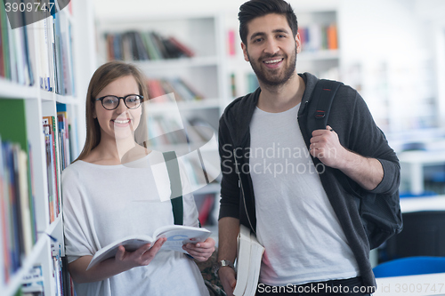 Image of students couple  in school  library