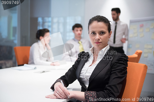 Image of young business woman on meeting  using laptop computer