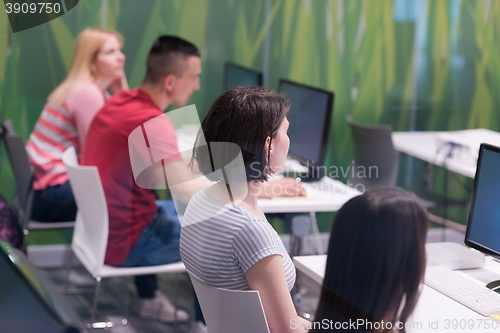 Image of teacher and students in computer lab classroom