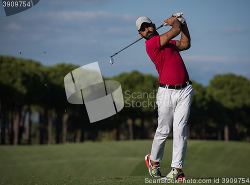 Image of golf player hitting long shot