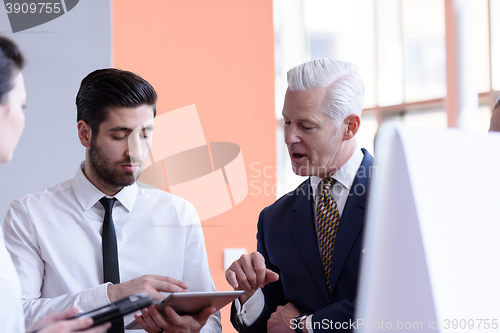 Image of young startup businessman making presentation to senior investio