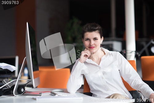 Image of happy young business woman relaxing and geting insiration