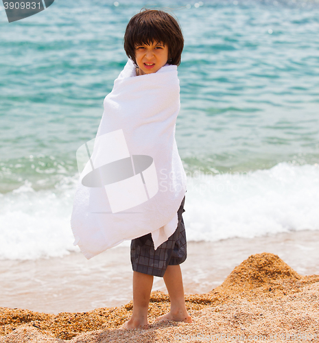 Image of young swimmer wrapped in a towel
