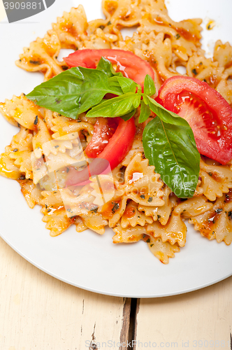 Image of Italian pasta farfalle butterfly bow-tie and tomato sauce