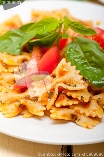 Image of Italian pasta farfalle butterfly bow-tie and tomato sauce