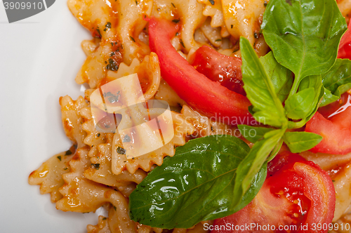Image of Italian pasta farfalle butterfly bow-tie and tomato sauce