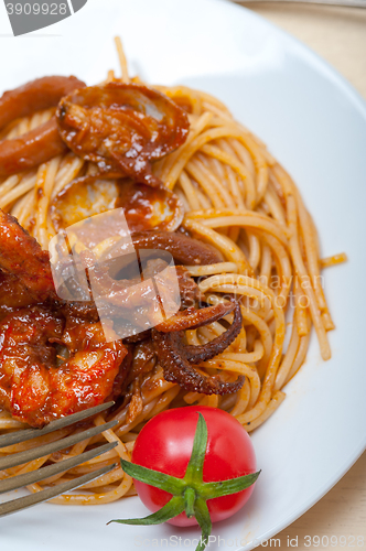 Image of Italian seafood spaghetti pasta on red tomato sauce 