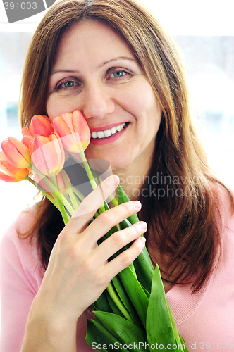Image of Mature woman with flowers
