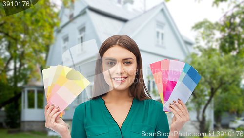 Image of smiling young woman with color swatches