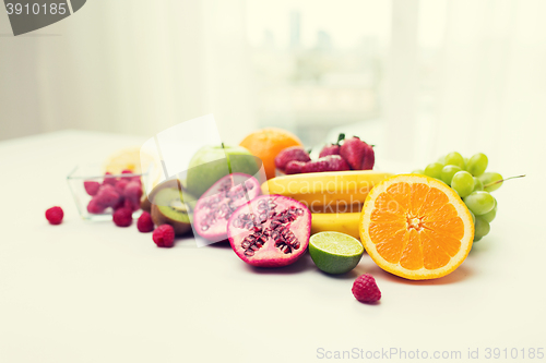 Image of close up of fresh fruits and berries on table