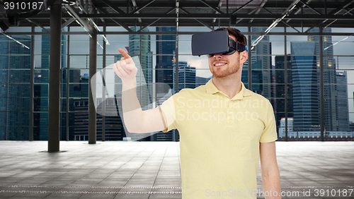 Image of happy man in virtual reality headset or 3d glasses