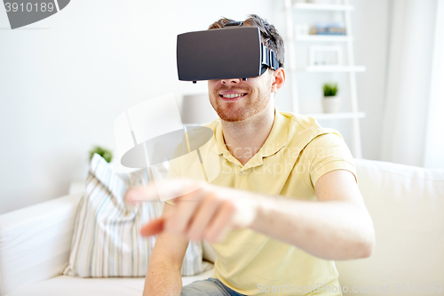 Image of young man in virtual reality headset or 3d glasses