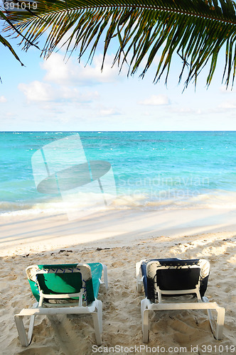 Image of Beach chairs on ocean shore