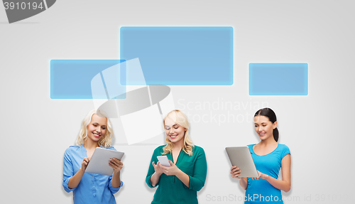 Image of happy women with smartphone and tablet pc computer