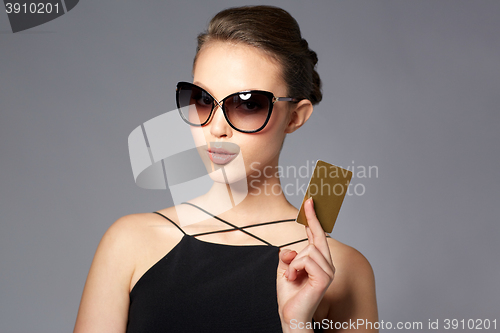 Image of beautiful young woman in elegant black sunglasses