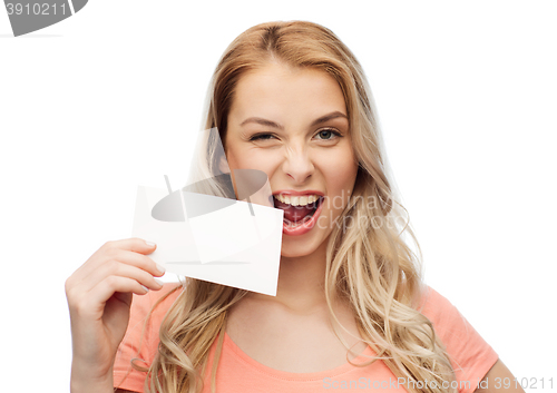 Image of happy woman or teen girl with blank white paper