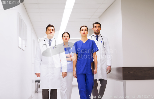 Image of group of medics or doctors at hospital corridor