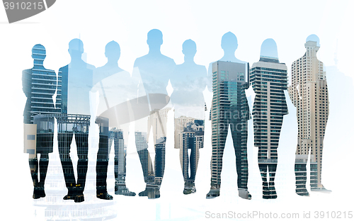 Image of business people silhouettes over city background
