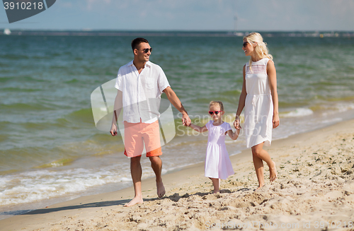 Image of happy family in sunglasses on summer beach