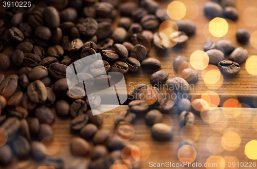 Image of close up coffee beans on wooden table