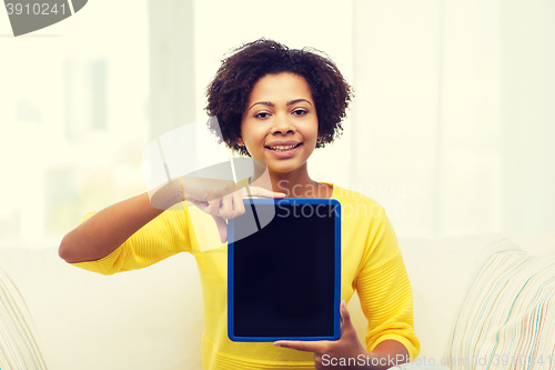 Image of happy african american woman with tablet pc