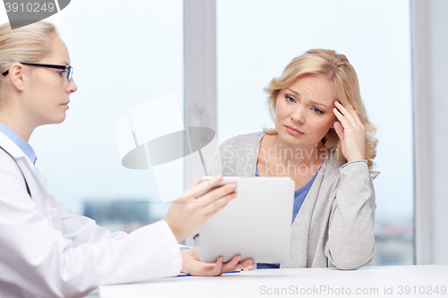 Image of doctor with tablet pc and ill woman at hospital