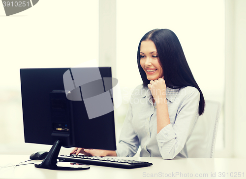 Image of smiling businesswoman or student with computer