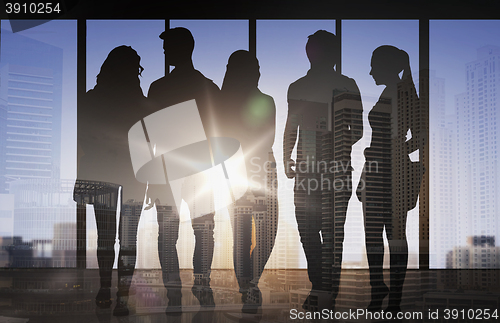 Image of people silhouettes over city airport background