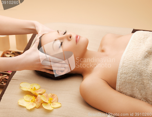 Image of beautiful woman in massage salon