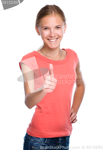 Image of Young girl is showing thumb up gesture