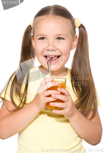 Image of Little girl is drinking carrot juice