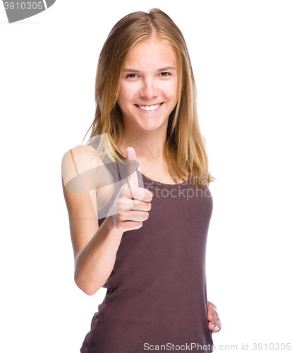 Image of Woman is showing thumb up gesture