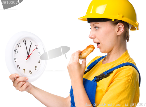 Image of Young construction worker is going to lunch