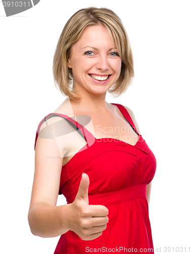 Image of Woman is showing thumb up gesture