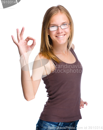 Image of Young teen girl is showing OK sign