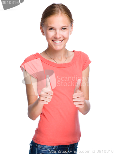 Image of Young girl is showing thumb up gesture