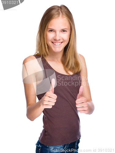 Image of Young girl is showing thumb up gesture