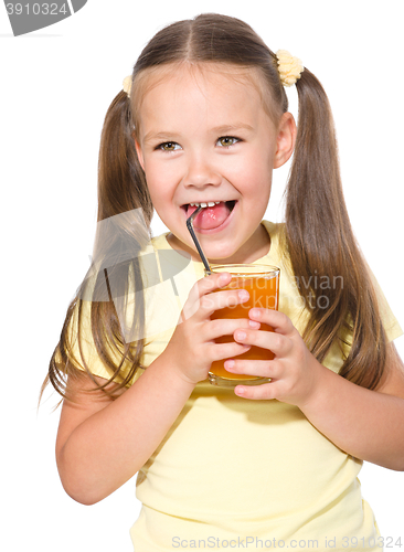 Image of Little girl is drinking carrot juice