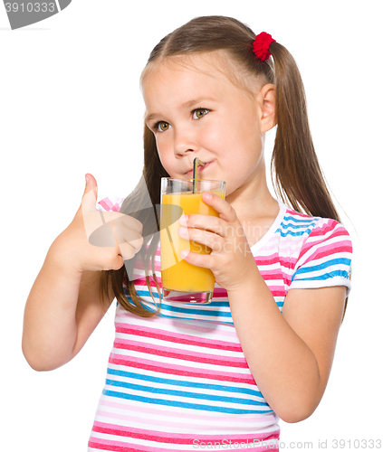 Image of Little girl is drinking orange juice