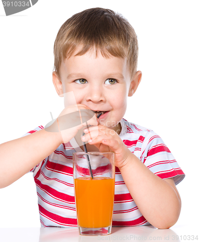 Image of Little boy with glass of carrot juice