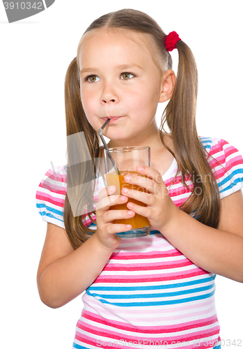 Image of Little girl is drinking carrot juice